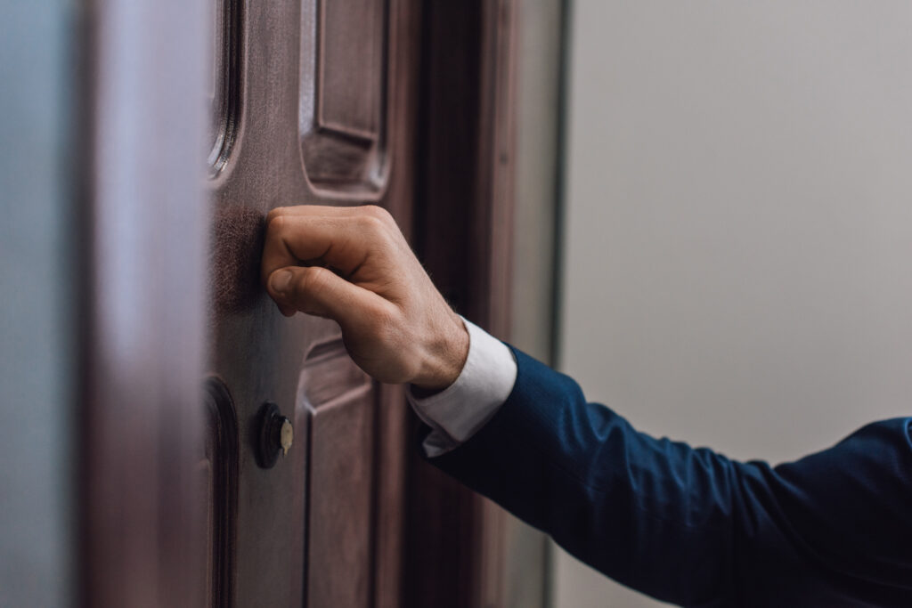 Sales representative knocking on the door