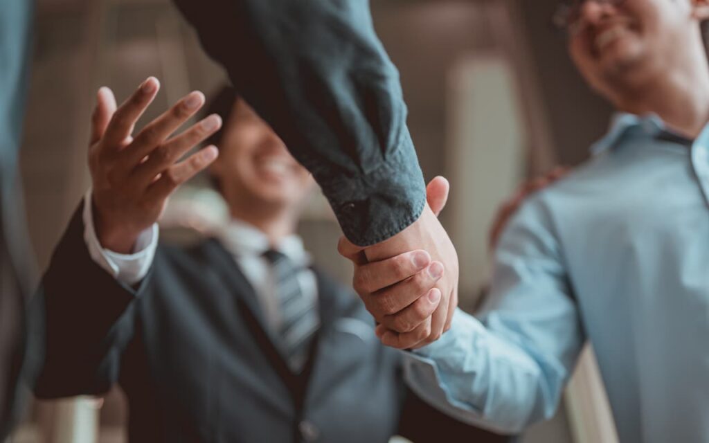 Client handshake with firm executive
